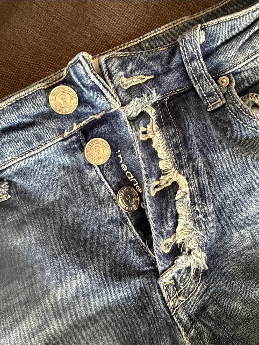 Ripped Light Blue Skinny Jeans with Button-Fly